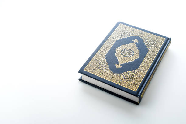 istock The Holy Al Quran with written Arabic calligraphy 1504125336