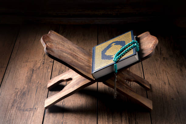 The Holy Al Quran with written Arabic calligraphy
