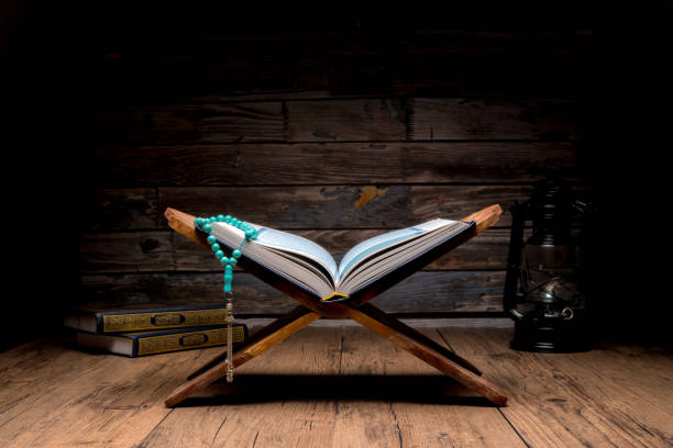 istock The Holy Al Quran with written Arabic calligraphy 1504128066