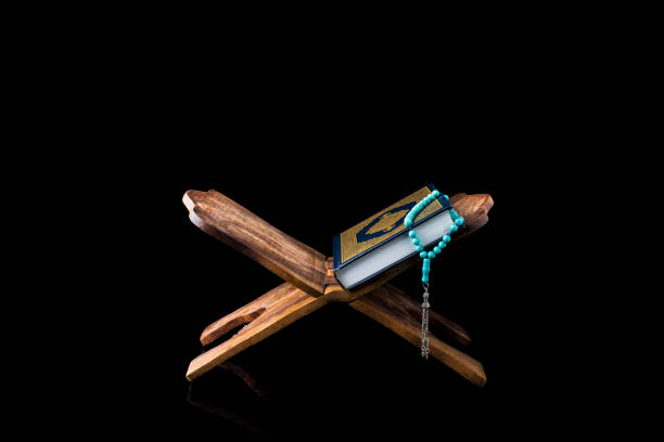 istock The Holy Al Quran with written Arabic calligraphy 1504128607