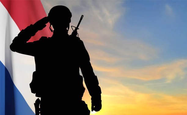 istock Silhouette of a saluting soldier against the sunset 1504152163