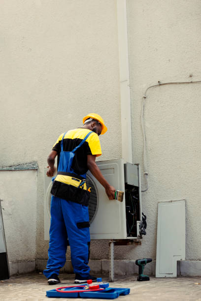 istock Repairman cleaning clogged air filter 1504162457
