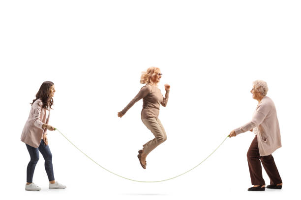 istock Young and older women playing skipping rope 1504165573