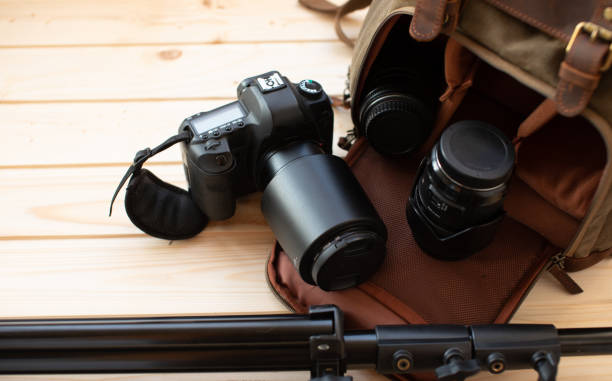 istock Photographer pack his camera and lenses to backpack. 1504169562