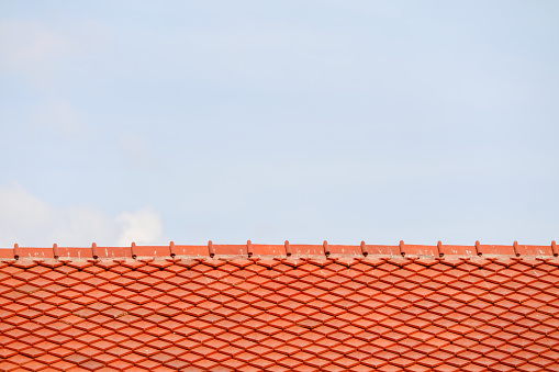 Roof on top and blue sky white cloud background. Pattern of roof. tile top protection