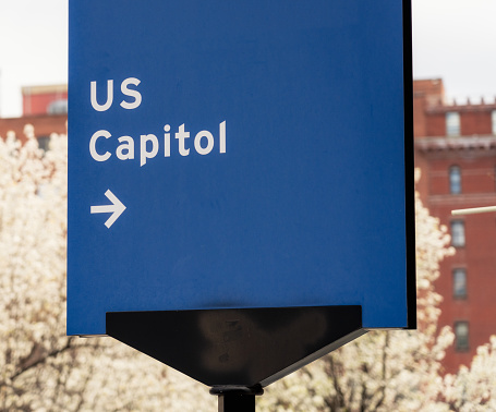 A sign directing people towards the US Capitol building in Washington DC.