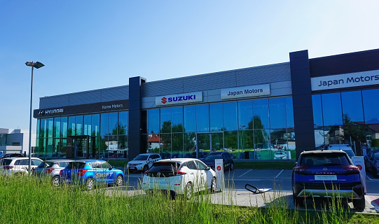Krakow, Poland - May 21, 2023: Suzuki logo at store. Suzuki Motor Corporation is a Japanese multinational corporation headquartered in Minami-ku, Hamamatsu, Japan.