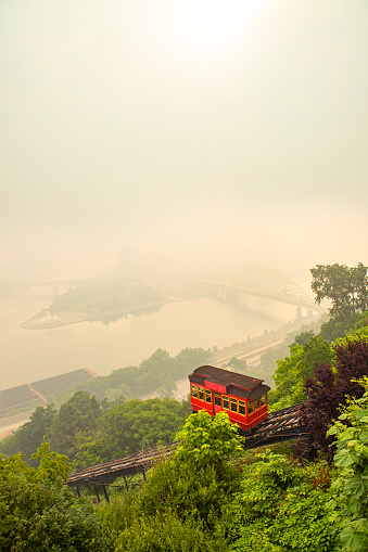The Duquesne Incline on it's way down Mt. Washington as the city is barely visible though the smoke and fog from the Canadian forest fires.