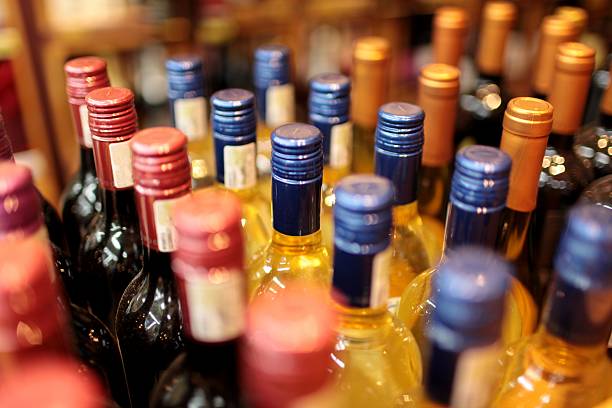 istock Rows of wine bottles with colorful tops 150419688