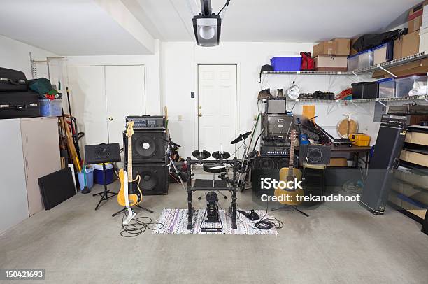 Rock Band Music Equipment In Cluttered Garage Stock Photo - Download Image Now - Garage, Performance Group, Domestic Room