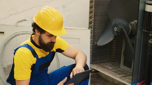 istock Engineer looks online for new blower fan 1504217983