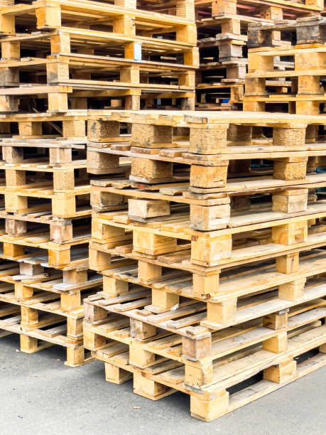 istock Wooden pallets stacked in columns 1504218225