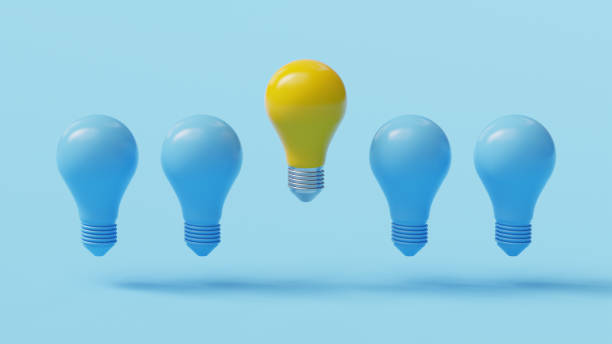 istock Glowing yellow Light Bulb between the others on light blue background. Leadership, innovation, great idea and individuality concepts. 3d rendered illustration 1504218318