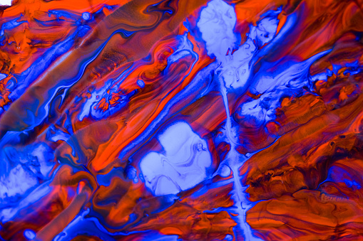 Abstract background of colorful creative acrilic painting. Oil move to water. Blue, orange, red and yellow pallete