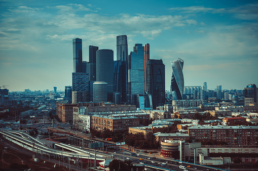 Moscow city modern business center. Panoramic view from high building. Retro style film colors.