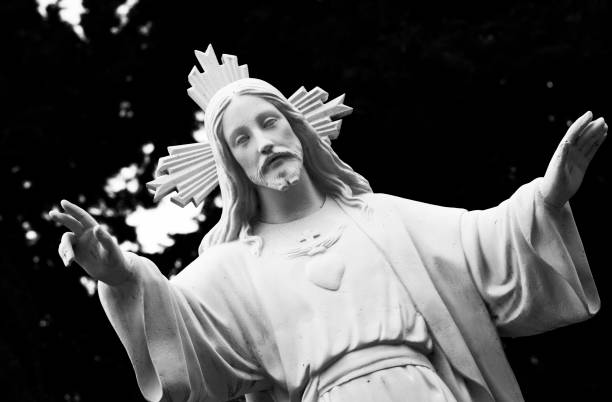 istock white christ with burning heart giving blessing 1504228017