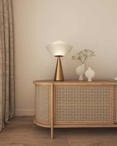 istock Commode with book, vase and lamp in livingroom interior. Light beige wall mock up background. 3d rendering. High quality 3d illustration 1504241921