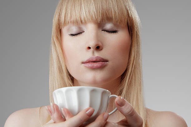 istock Young beautiful woman with tea 150424302