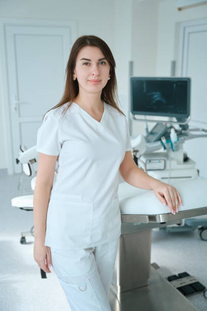istock Confident doctor standing in the gynecological office 1504250521