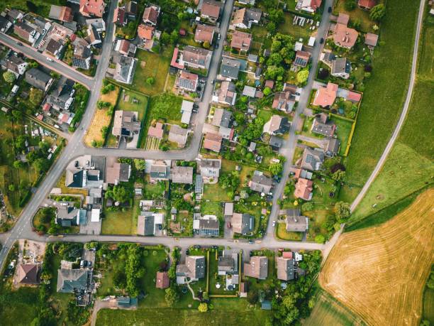 istock Village enveloped in a green landscape of trees and fields. Germany. 1504251731