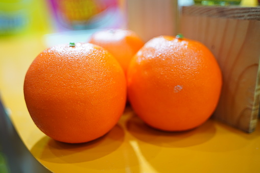 Colorful bright background of fresh ripe sweet citrus fruits: orange and red grapefruit, green lime and yellow lemon, tangerine and kumquat