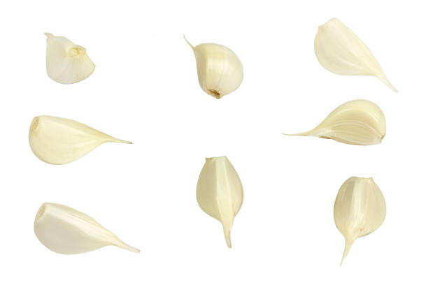 istock garlic. Garlic cloves isolated from background 1504270223