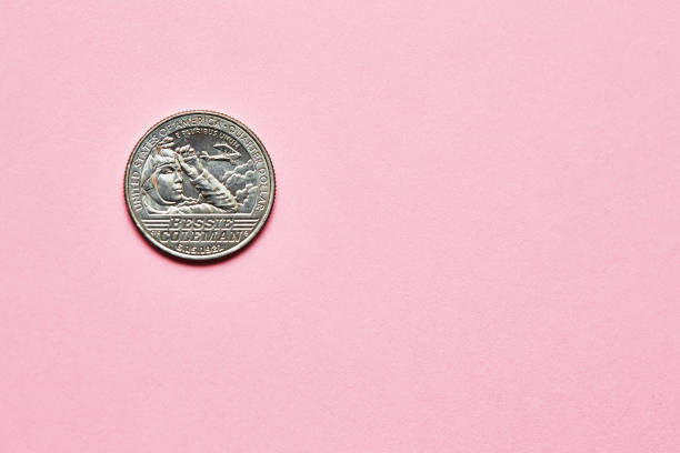 istock US quarter dollar coin on a pink background with copy space 1504271336