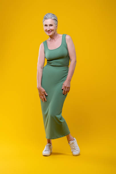 istock Woman in green dancing and feeling happy 1504274717