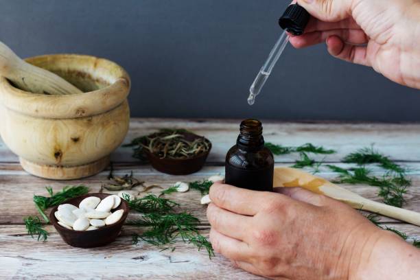 istock Woman using dill organic oil as alternative medicine 1504299805