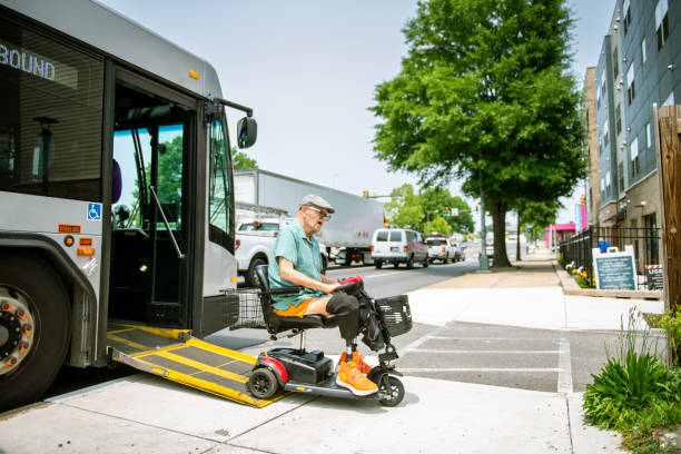 Disabled senior man arrives at bus stop