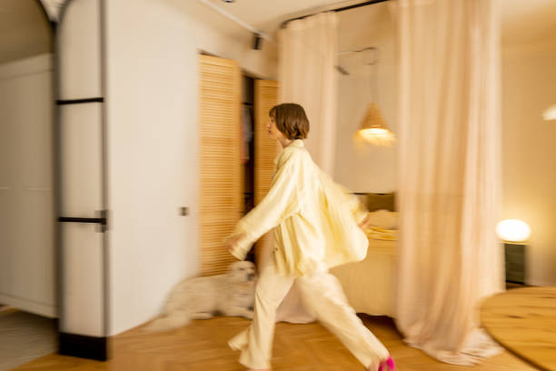 istock Apartment interior with motion blurred female figure 1504307616
