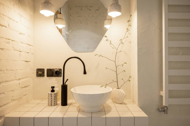 istock White sink and black faucet on tiled table top 1504309228