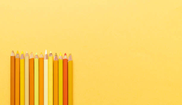 istock Back to class. Coloured pencils on yellow background. Copy space. Top view. 1504309811