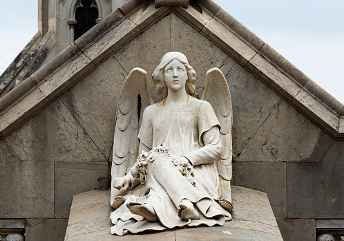 Statue of the fallen angel fountain in the Parque del Buen Retiro. Madrid.