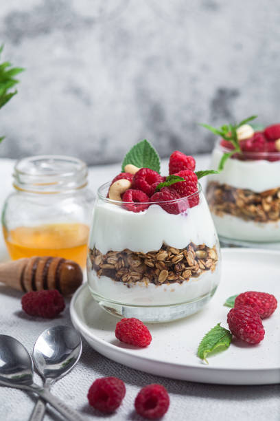 istock Granola with yogurt and raspberries in a glass 1504327922