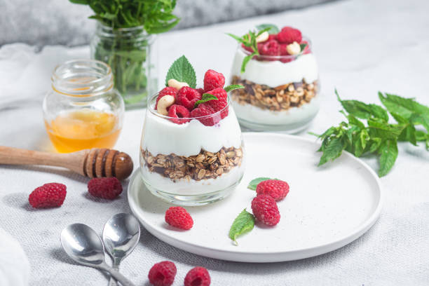 istock Granola with yogurt and raspberries in a glass 1504327924