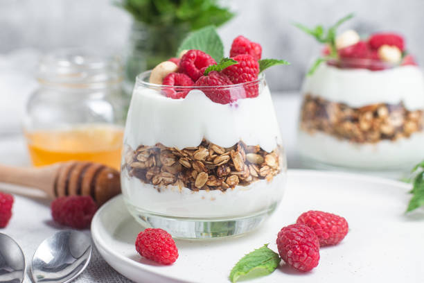 istock Granola with yogurt and raspberries in a glass 1504328505