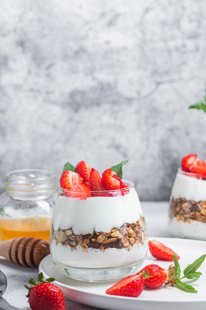 istock Granola with yogurt and strawberries in a glass 1504331935