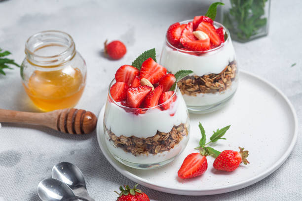 istock Granola with yogurt and strawberries in a glass 1504331959