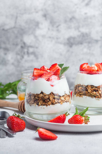 istock Granola with yogurt and strawberries in a glass 1504331962