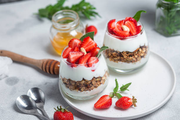 istock Granola with yogurt and strawberries in a glass 1504331977