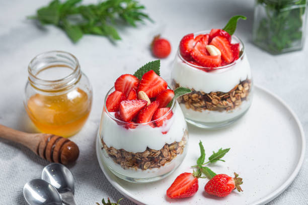 istock Granola with yogurt and strawberries in a glass 1504331989