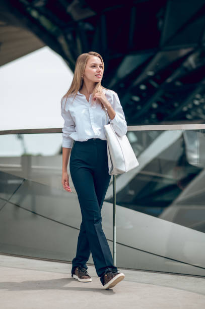 istock Pretty elegant young business woman looking contented 1504354674