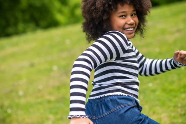 istock Curly-haired cute kid running and feeling excited 1504355845