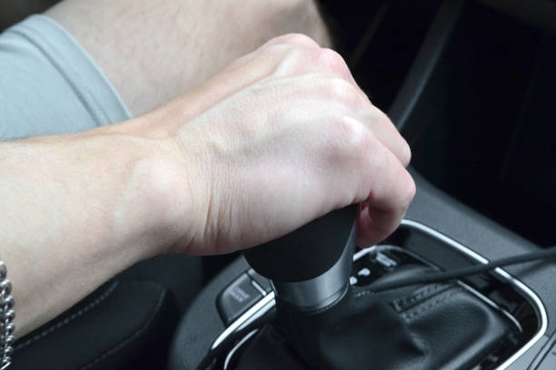 istock the man keeps his hand on the gearbox 1504412933