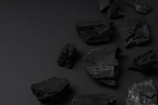 istock Flat lay with natural charcoal on black background 1504420115