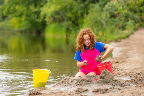 istock Girl Building A Sand Structure at The Beach 1504425026