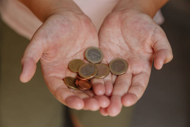 istock coins in hand, last money 1504446734