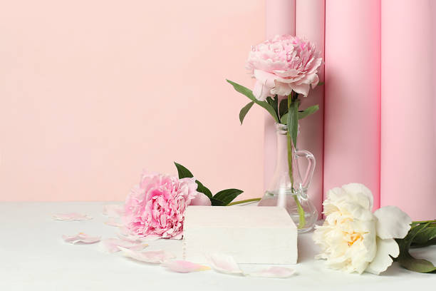 istock Minimal floral composition.Abstract background with empty podium and peonies flowers,empty showcase for display or presentation of cosmetic products, 1504450265