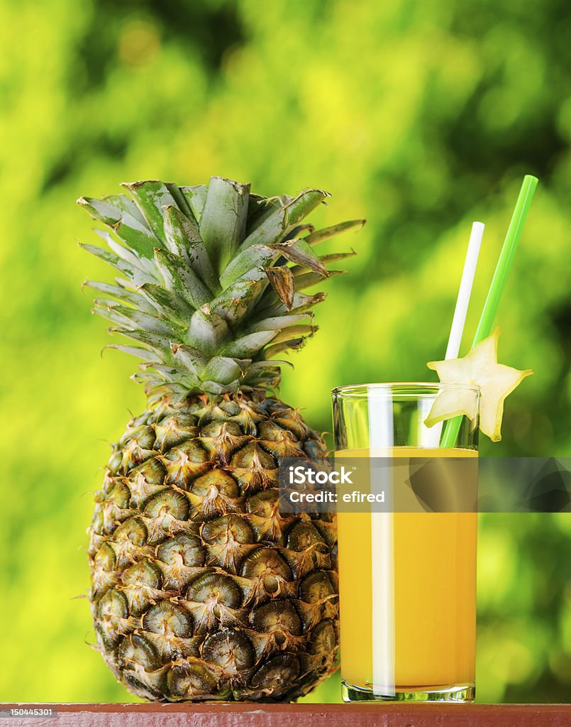 juice Glass of pineapple juice in a garden. Agriculture Stock Photo